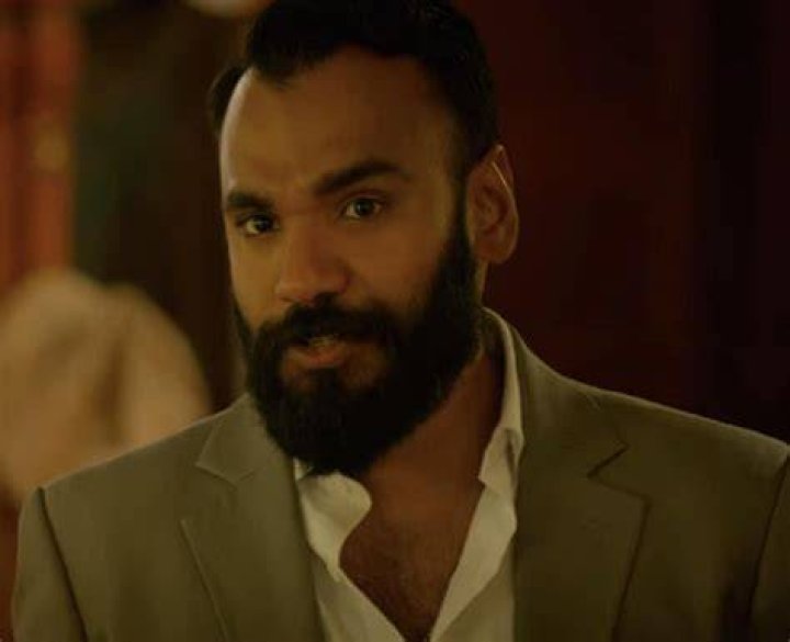 Andy McQueen as Carlos Singh in Outer Banks Season 3 Andy McQueen as Carlos Singh in Outer Banks Season 3