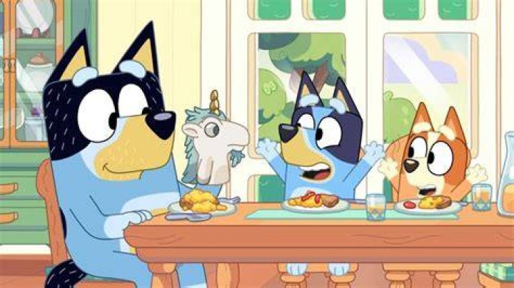 Bandit is has a puppet on his hand and is entertaining his daughters.